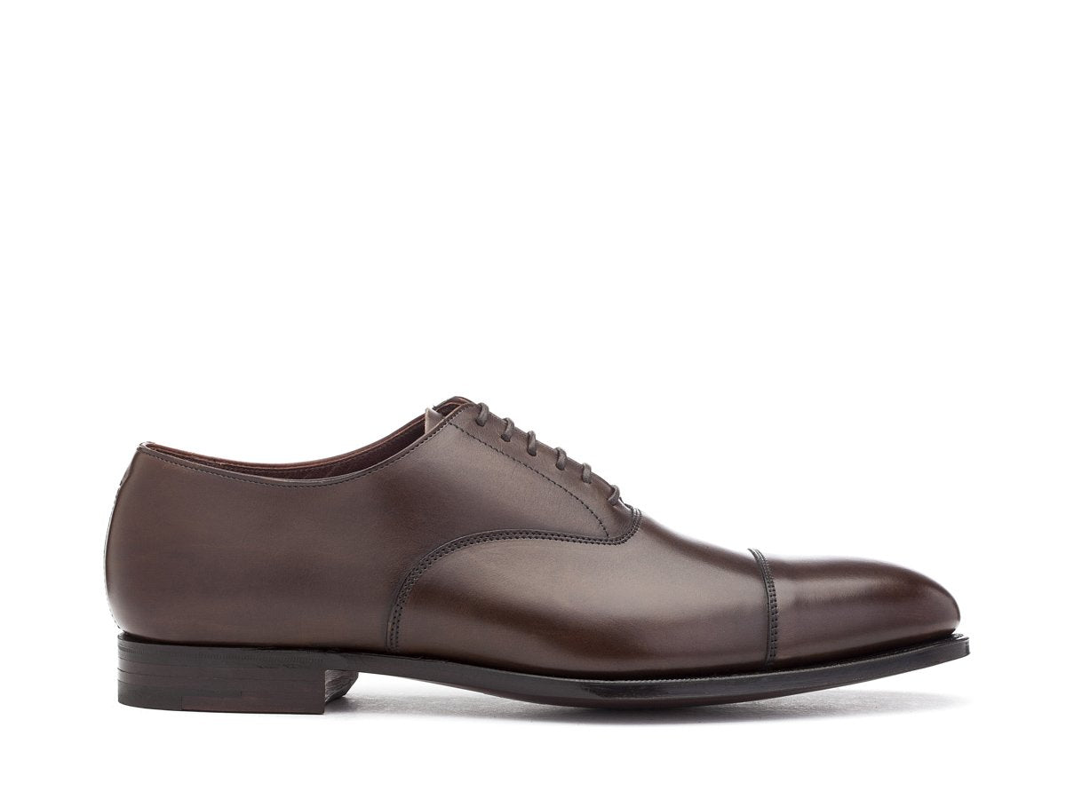 Side view of Crockett & Jones Lonsdale plain captoe oxford shoes in dark brown antique calf