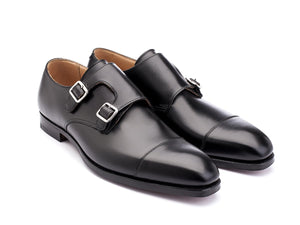 Front angle view of Crockett & Jones Lowndes captoe double monk strap shoes in black calf