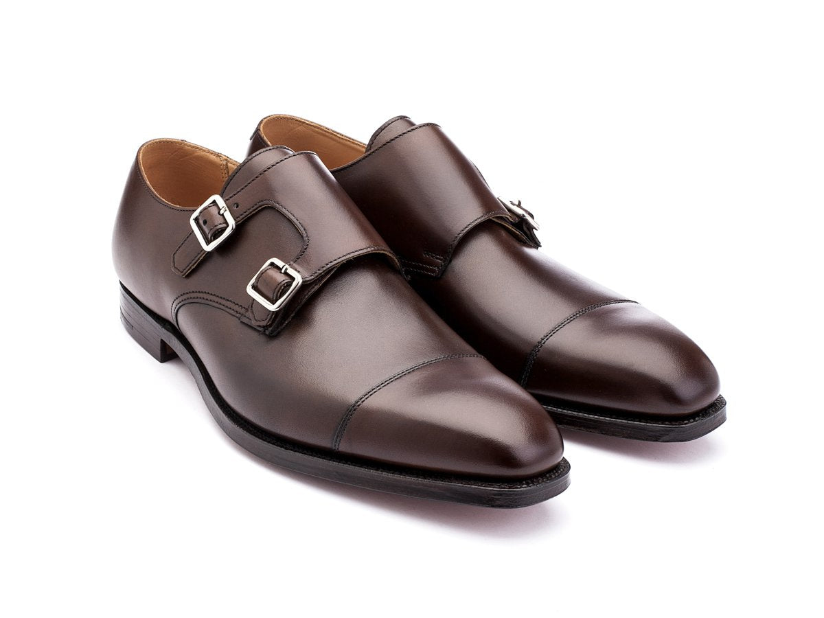 Front angle view of Crockett & Jones Lowndes captoe double monk strap shoes in dark brown burnished calf