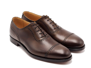 Front angle view of Crockett & Jones Macquarie adelaide brogue oxford shoes in dark brown burnished calf