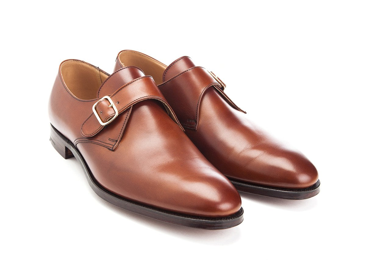 Front angle view of Crockett & Jones Malvern plain toe single monk strap shoes in chestnut burnished calf