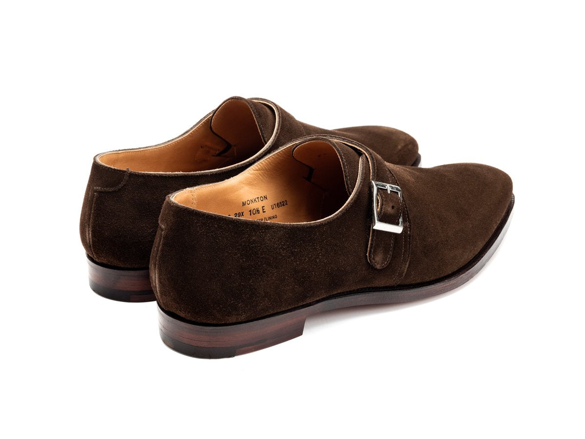 Back angle view of Crockett & Jones Monkton plain toe single monk strap shoes in dark brown suede