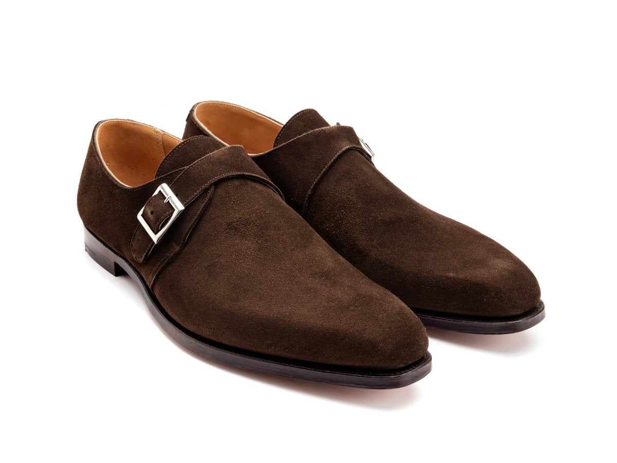 Front angle view of Crockett & Jones Monkton plain toe single monk strap shoes in dark brown suede