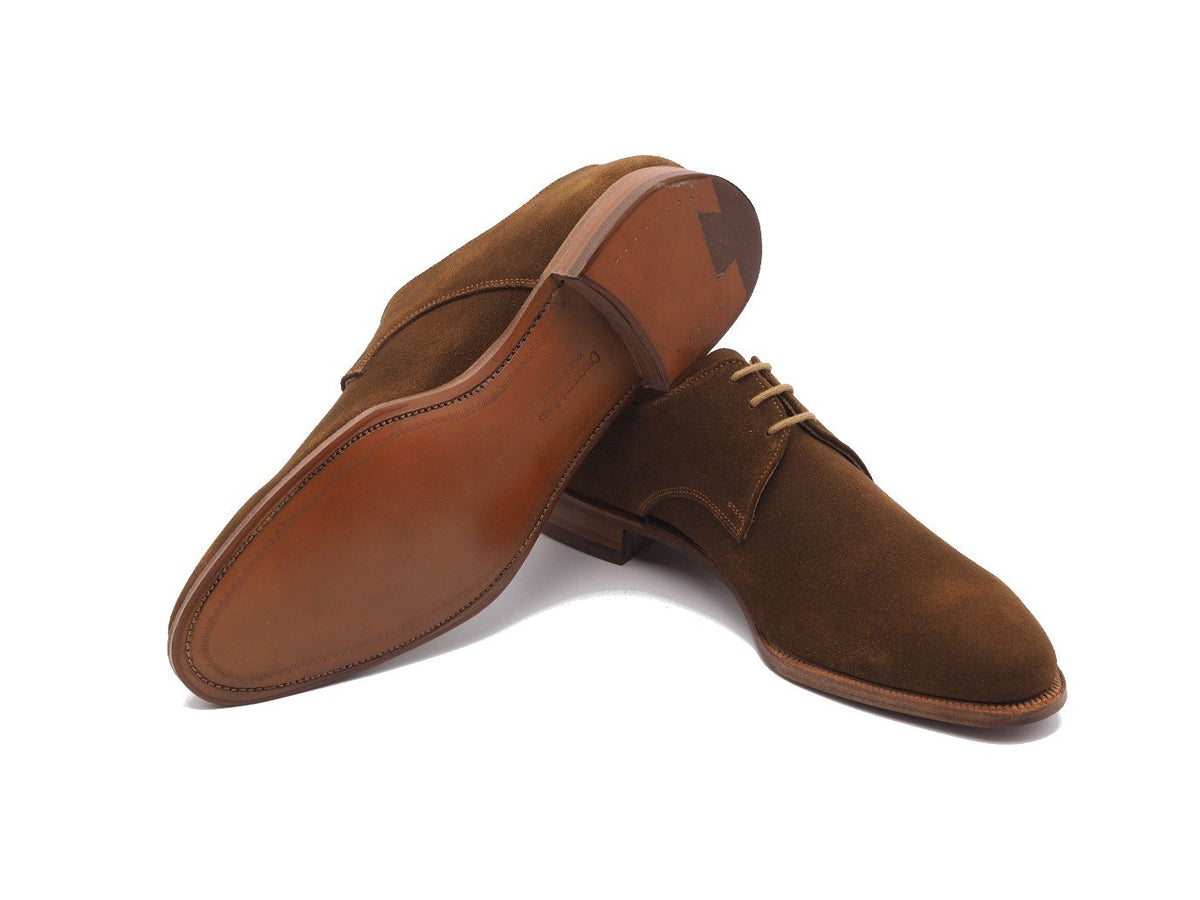 Leather sole of Crockett & Jones Newquay plain toe derby shoes in snuff suede