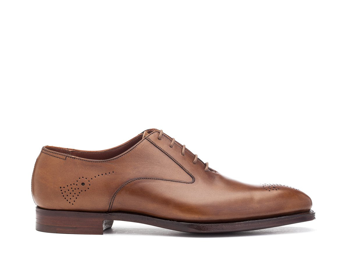 Side view of Crockett & Jones Rosemoor medallion brogue oxford shoes in tan antique calf