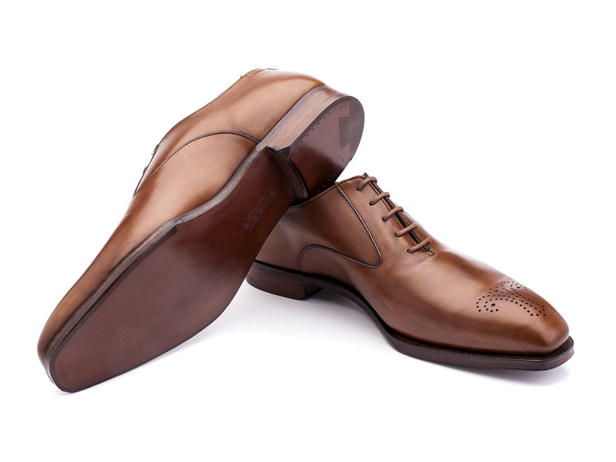 Leather sole of Crockett & Jones Rosemoor medallion brogue oxford shoes in tan antique calf