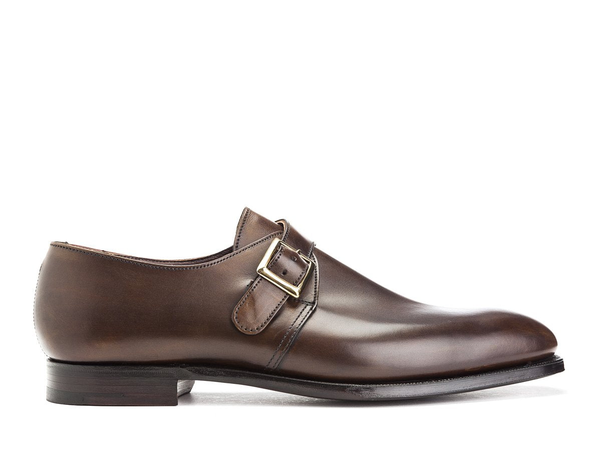 Side view of Crockett & Jones Savile plain toe single monk strap shoes in dark brown antique calf