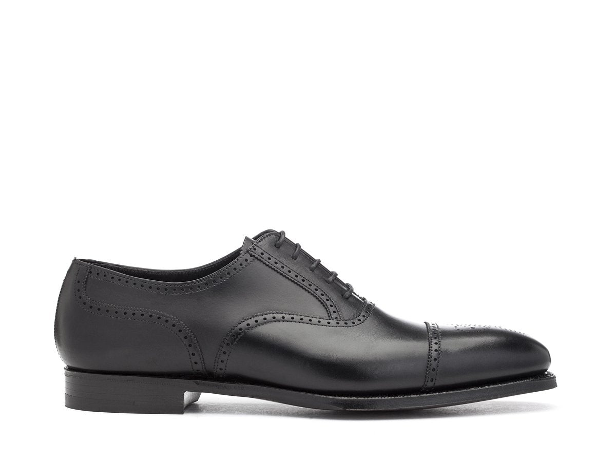 Side view of Crockett & Jones Selborne half brogue oxford shoes in black calf
