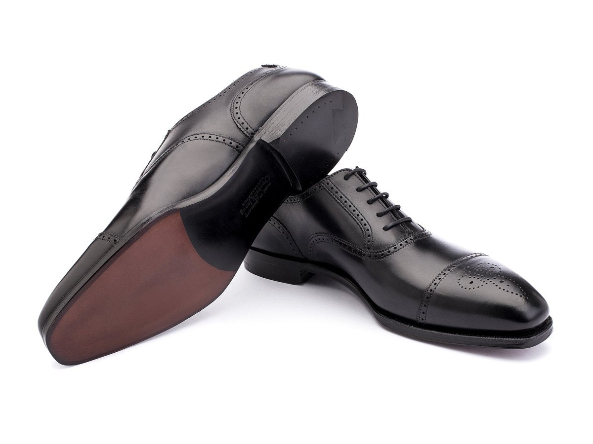 Leather sole of Crockett & Jones Selborne half brogue oxford shoes in black calf