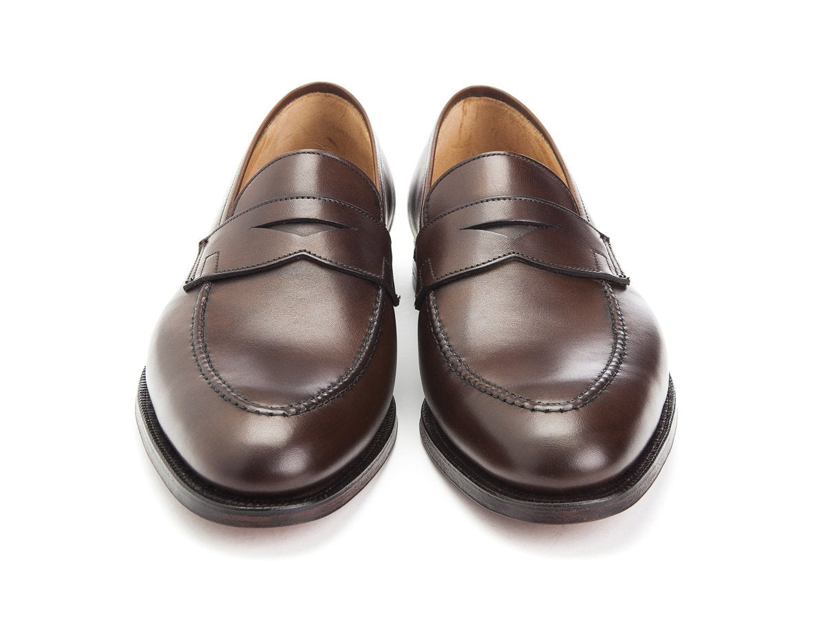 Front view of Crockett & Jones Sydney penny loafers in dark brown burnished calf