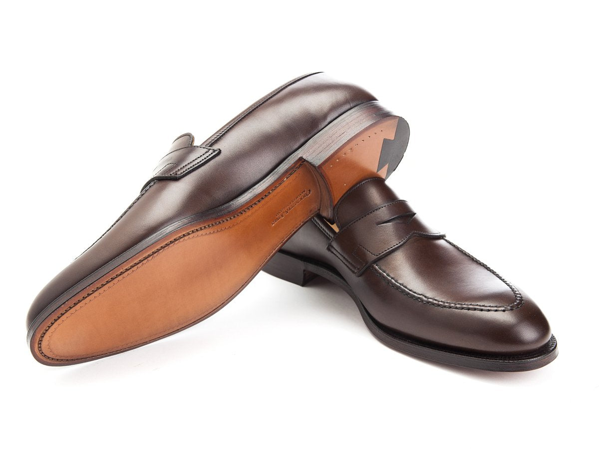 Leather sole of Crockett & Jones Sydney penny loafers in dark brown burnished calf