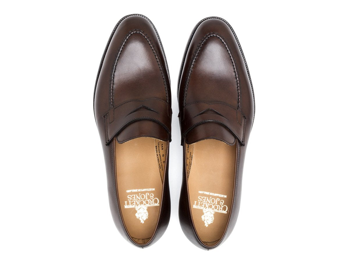 Top view of Crockett & Jones Sydney penny loafers in dark brown burnished calf