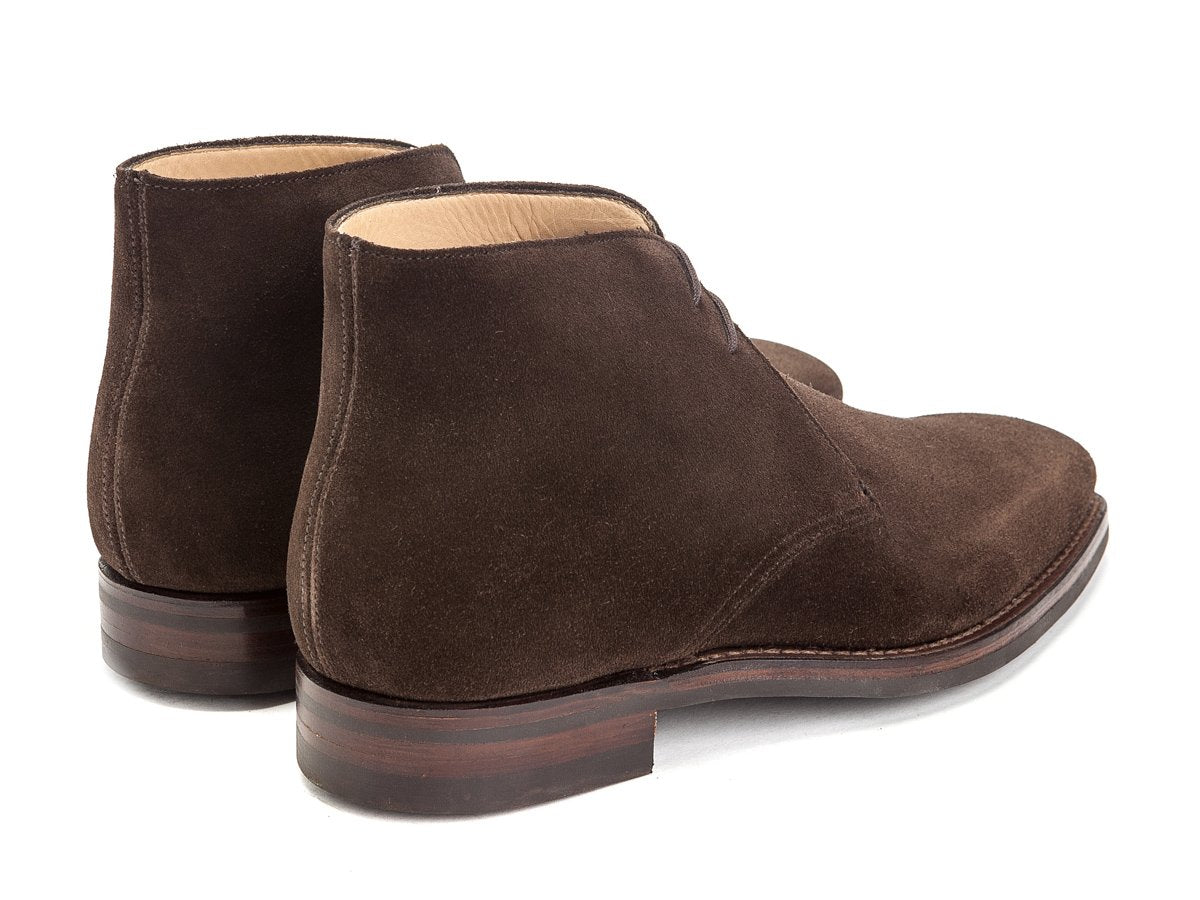 Back angle view of Crockett & Jones Tetbury chukka boots in dark brown suede