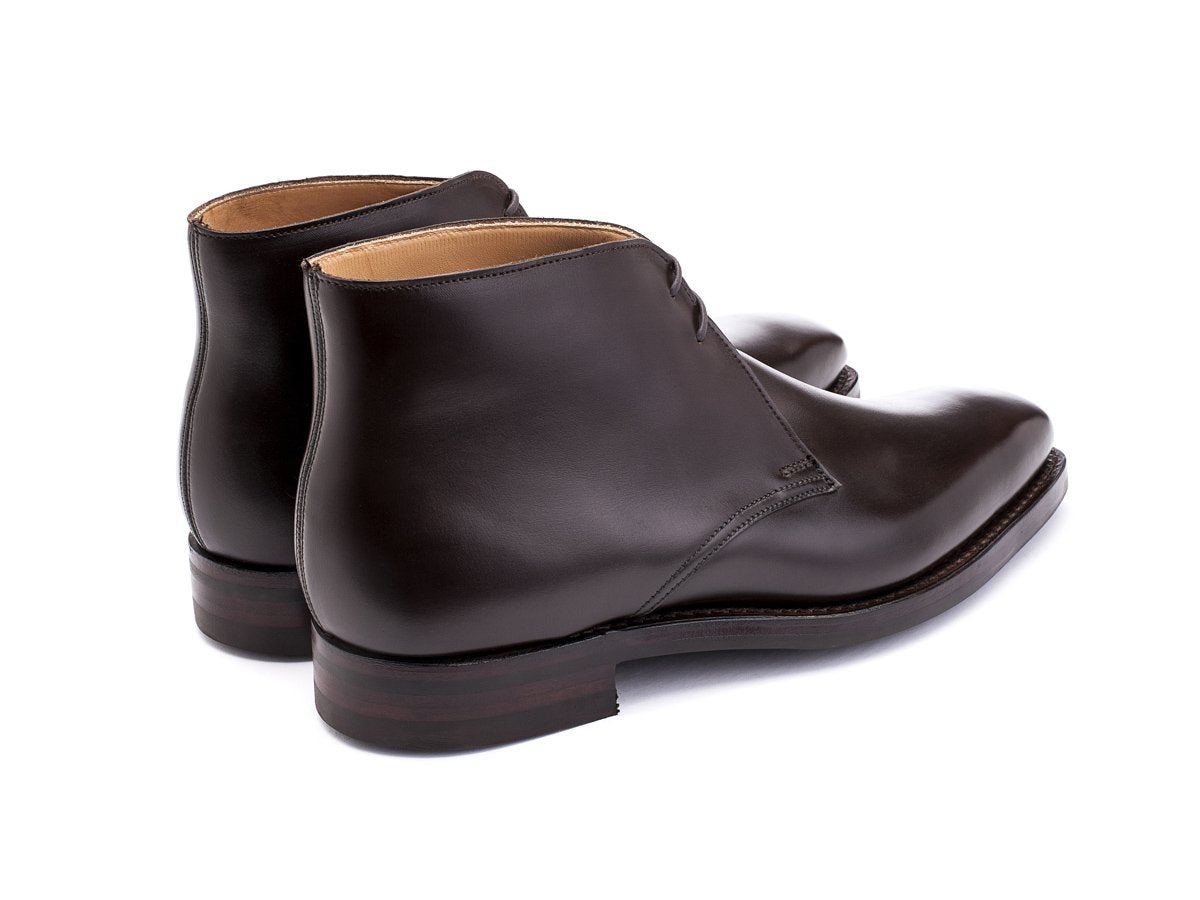 Back angle view of Crockett & Jones Tetbury chukka boots in dark brown calf