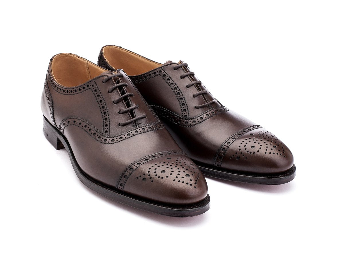 Front angle view of Crockett & Jones Westfield half brogue oxford shoes in dark brown burnished calf