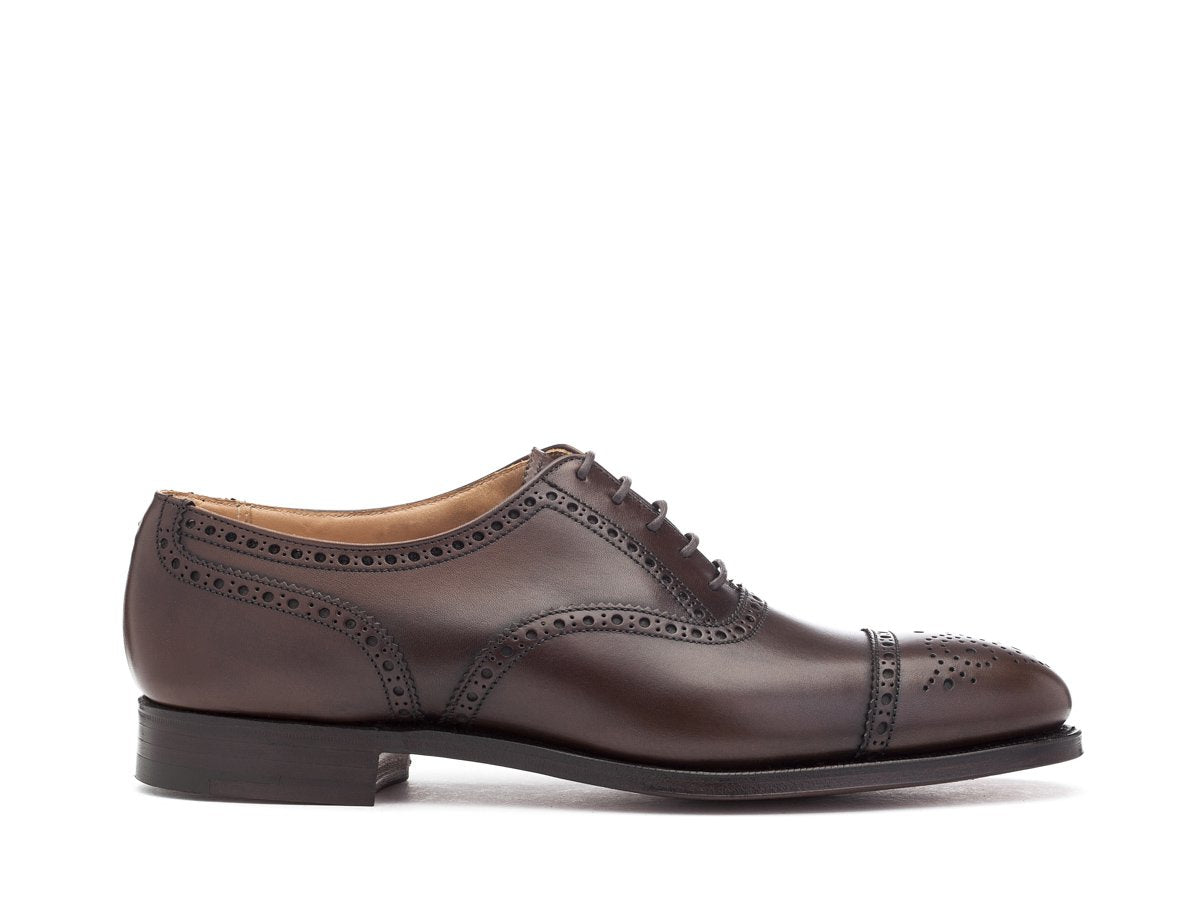 Side view of Crockett & Jones Westfield half brogue oxford shoes in dark brown burnished calf