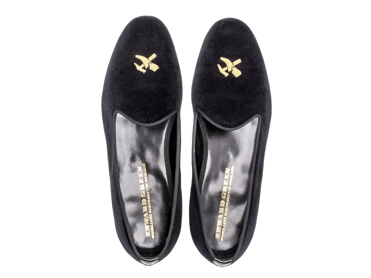 Top view of Edward Green Albert slippers in black velvet with hand embroidered gold Double Monk logo on toe