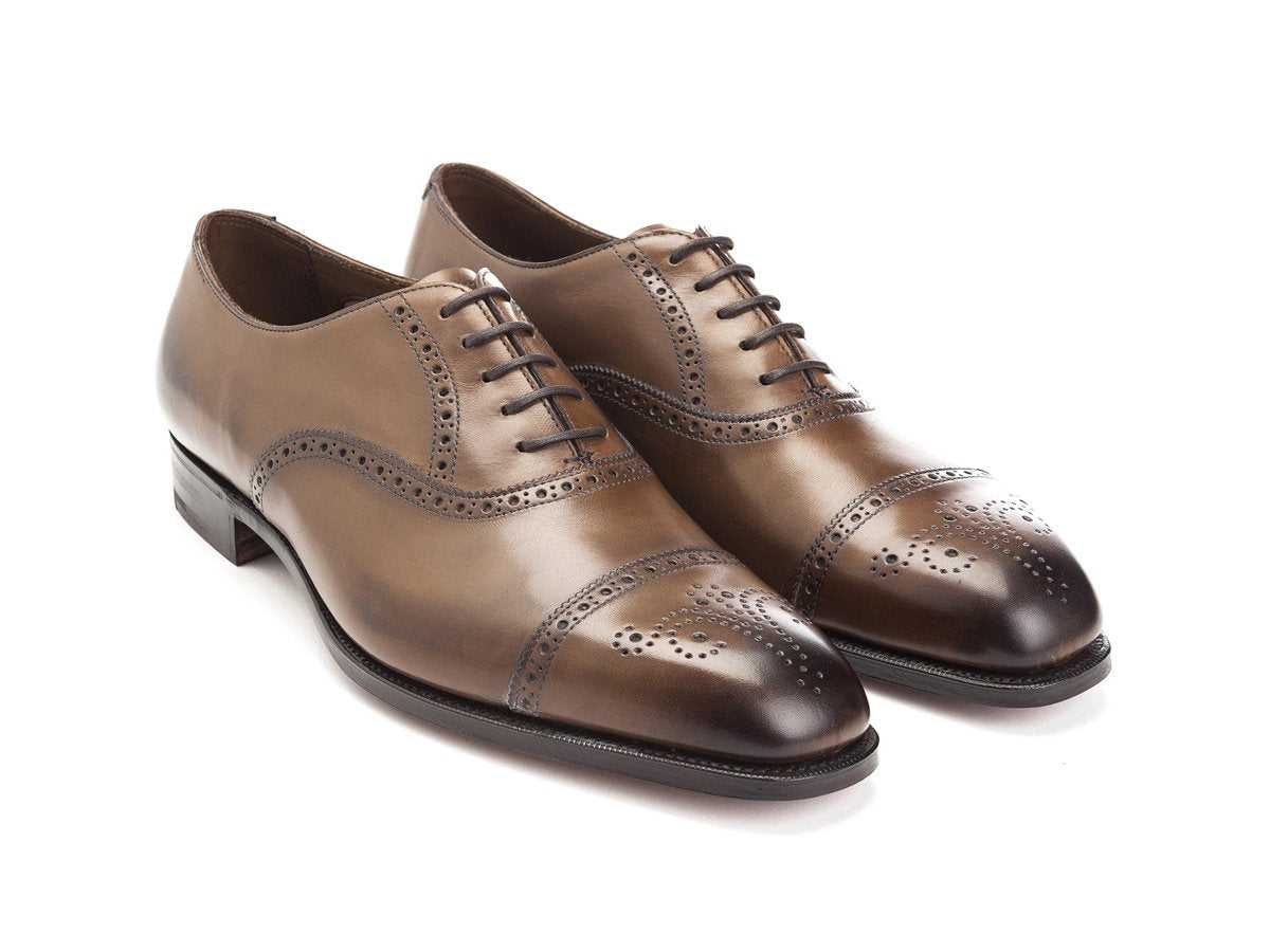 Front angle view of Edward Green Asquith half brogue oxford shoes in dark oak antique calf