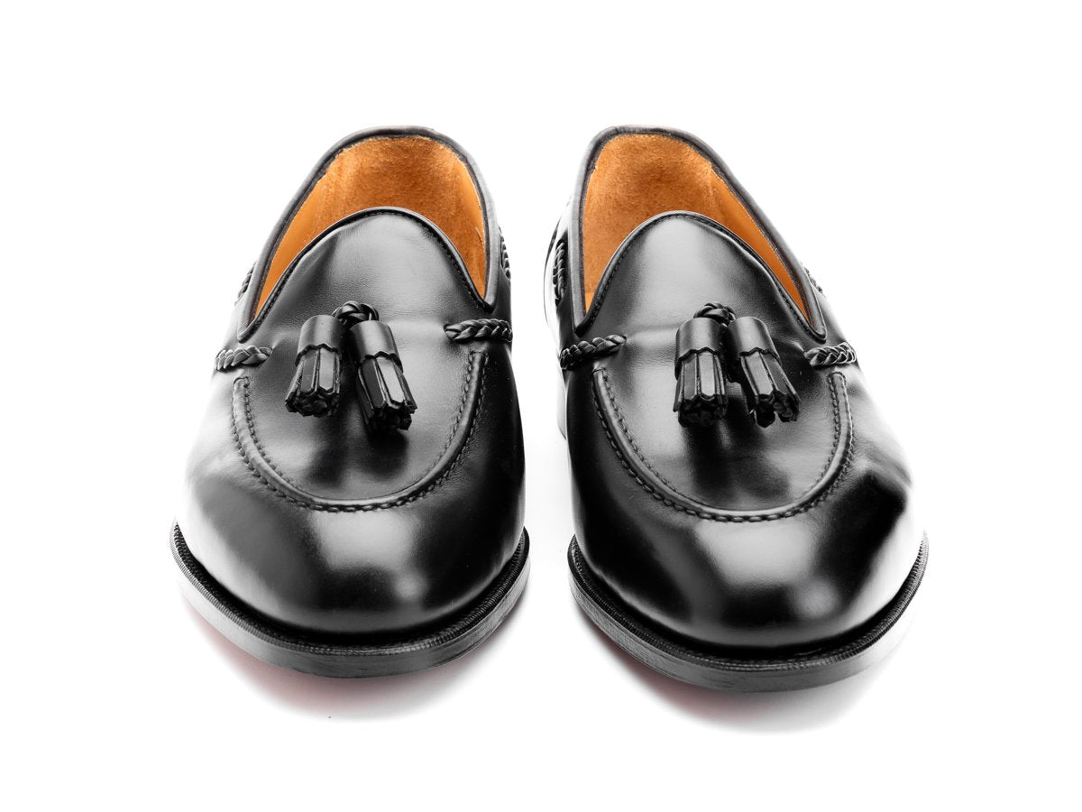 Front view of Edward Green Belgravia braided tassel loafers in black calf
