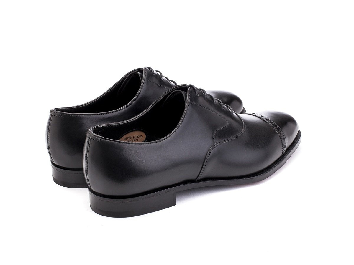 Back angle view of Edward Green Berkeley quarter brogue oxford shoes in black calf