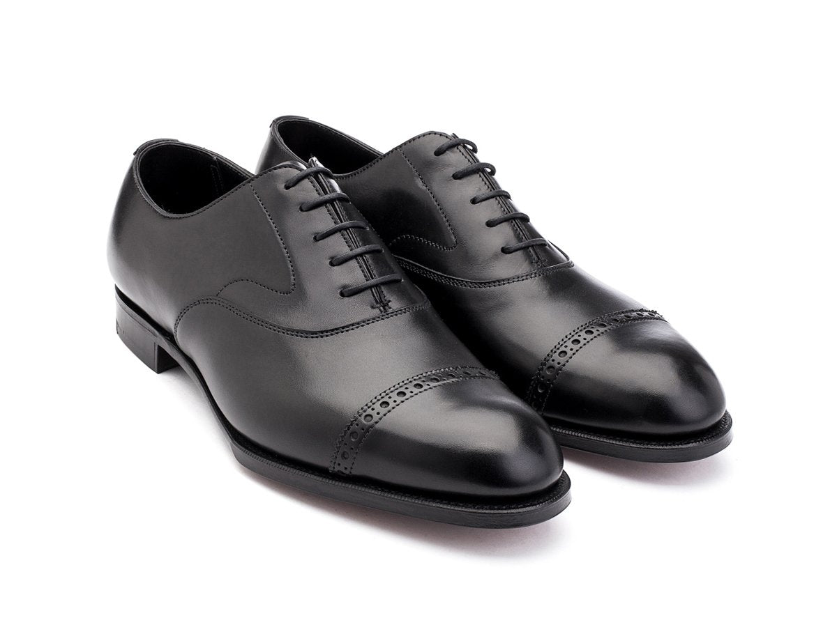 Front angle view of F width Edward Green Berkeley quarter brogue oxford shoes in black calf