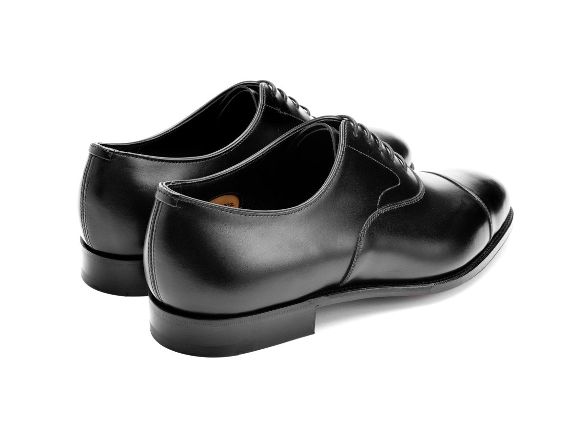 Back angle view of D width Edward Green Chelsea 202 plain captoe oxford shoes in black calf