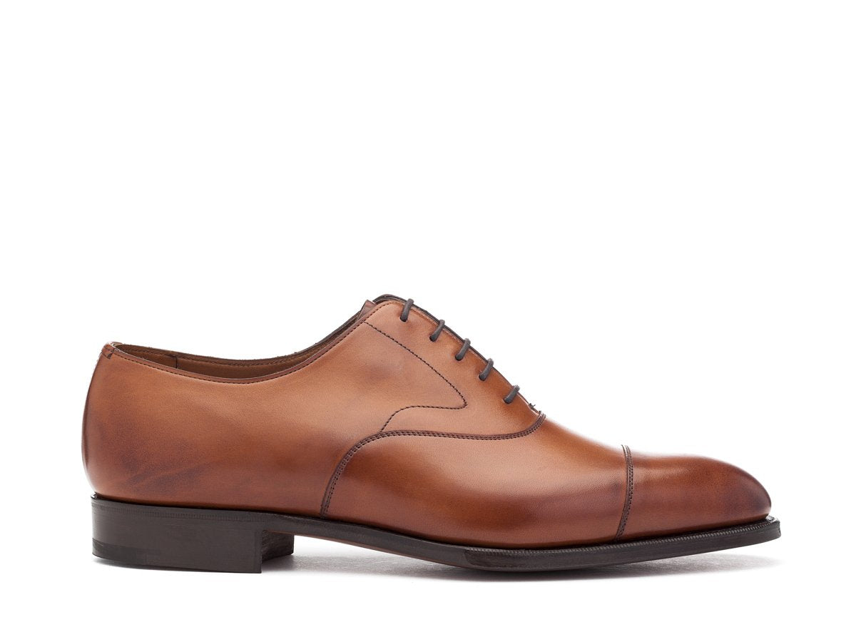 Side view of F width Edward Green Chelsea plain captoe oxford shoes in chestnut antique calf