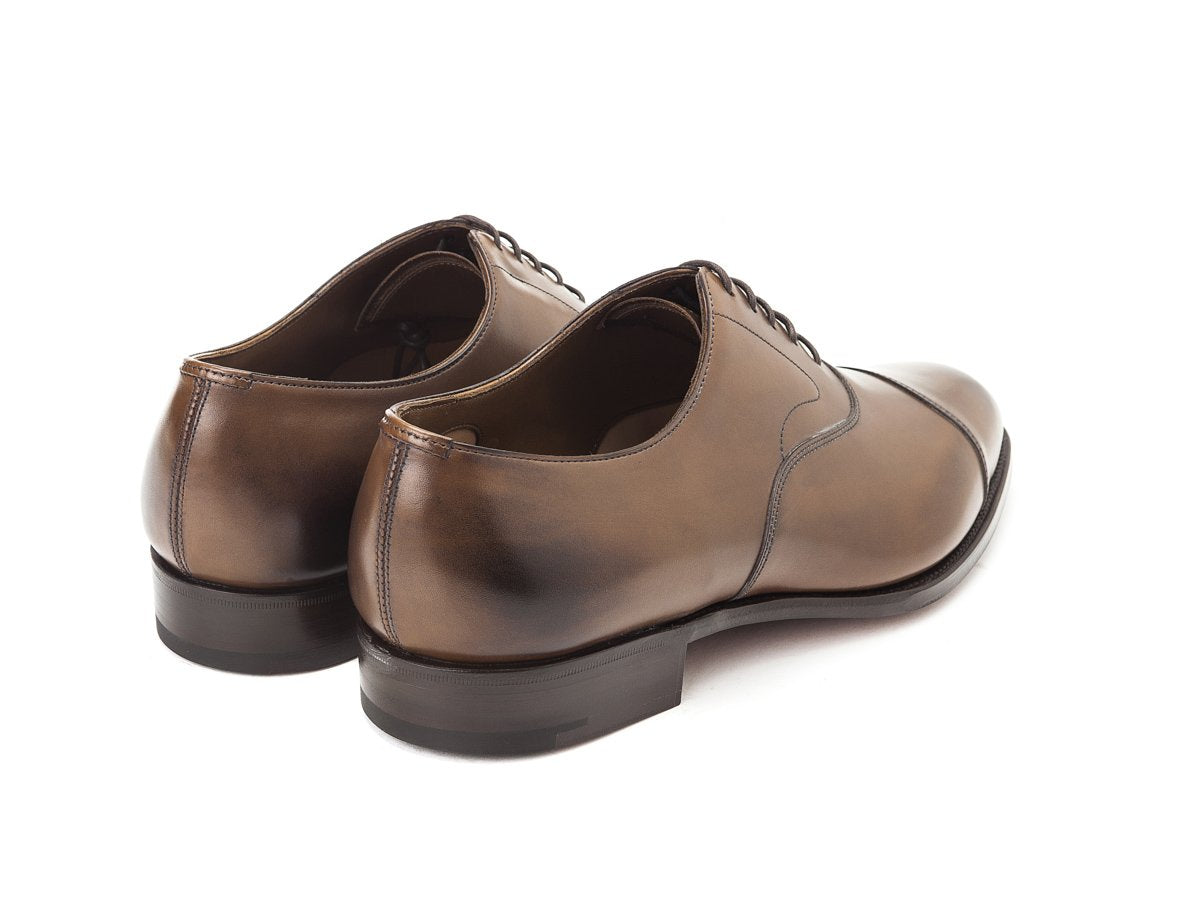 Back angle view of Edward Green Chelsea plain captoe oxford shoes in dark oak antique calf