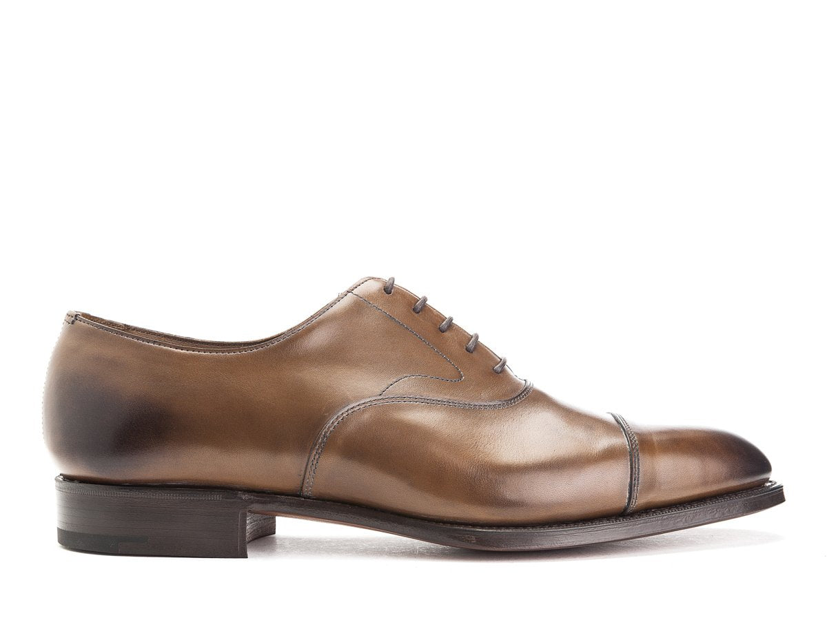 Side view of Edward Green Chelsea plain captoe oxford shoes in dark oak antique calf