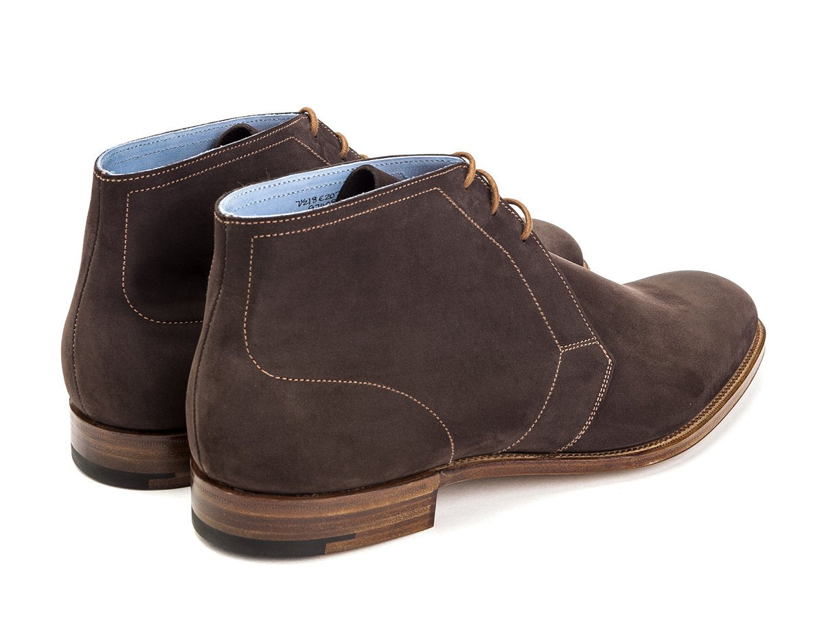 Back angle view of Edward Green Cherwell chukka boots in chocolate nubuck