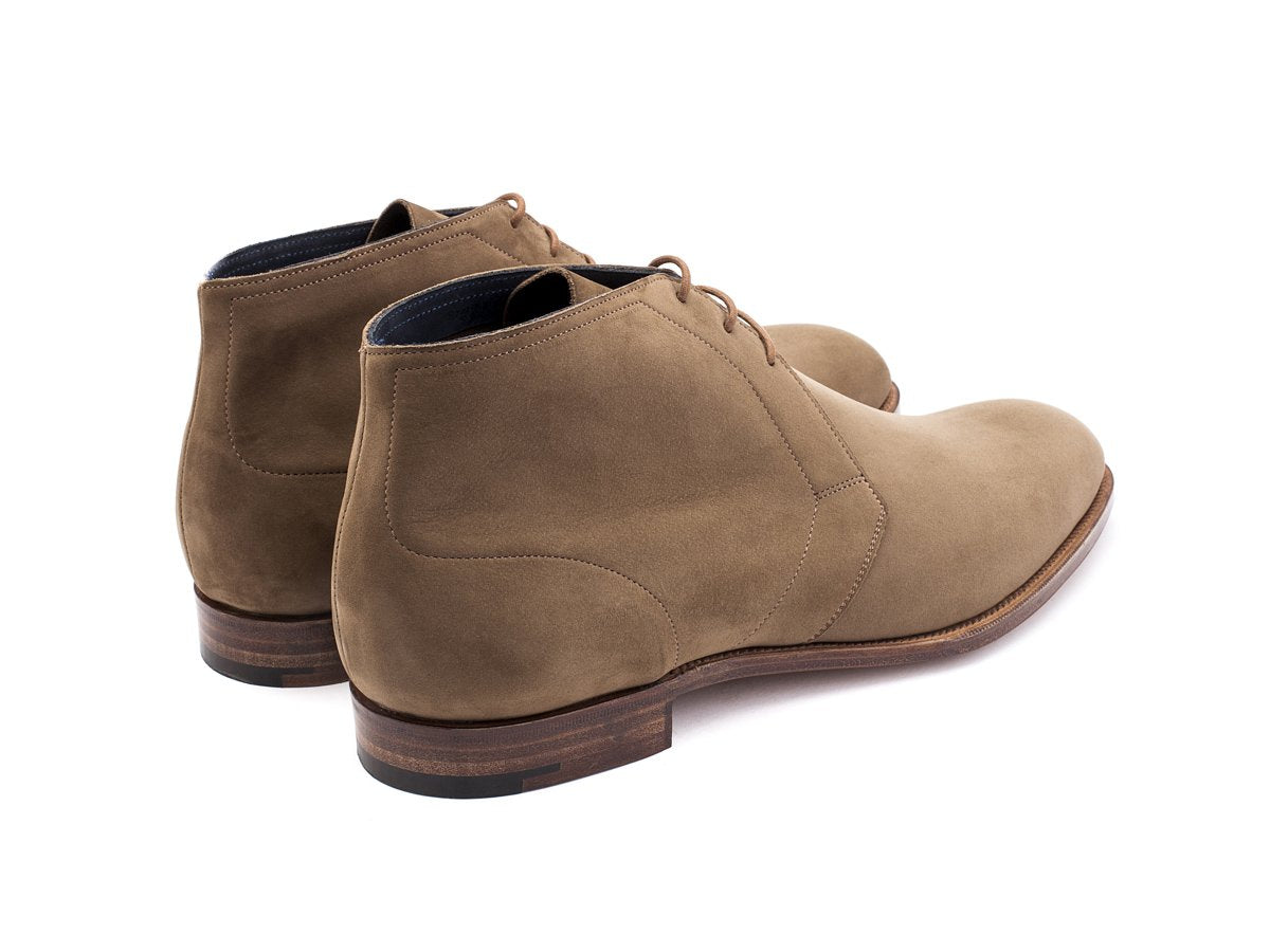 Back angle view of Edward Green F width Cherwell chukka boots in taupe nubuck