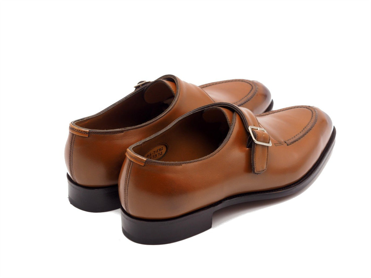 Back angle view of Edward Green Clapham split toe single monk strap shoes in chestnut antique calf