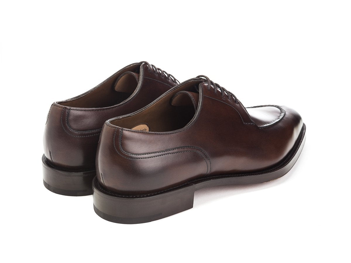 Back angle view of Edward Green Dover split toe derby shoes in dark oak antique calf