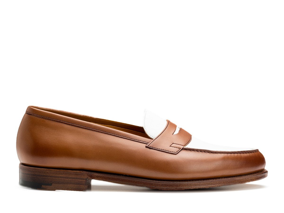 Side view of Edward Green Duke spectator penny loafers in hazel and white calf