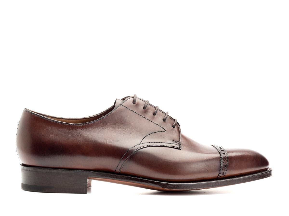 Side view of Edward Green Elmsley quarter brogue derby shoes in dark oak antique calf