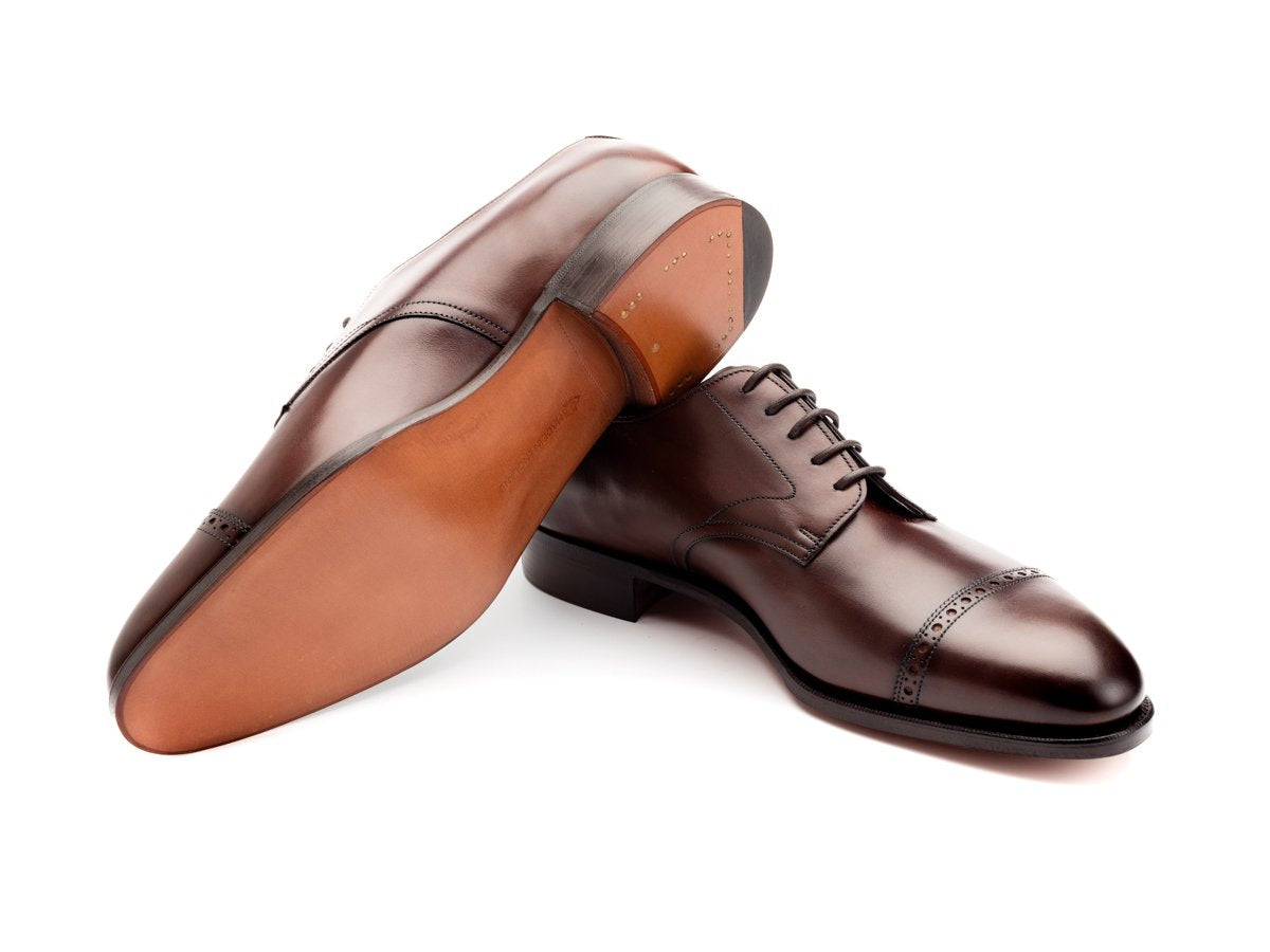 Leather sole of Edward Green Elmsley quarter brogue derby shoes in dark oak antique calf