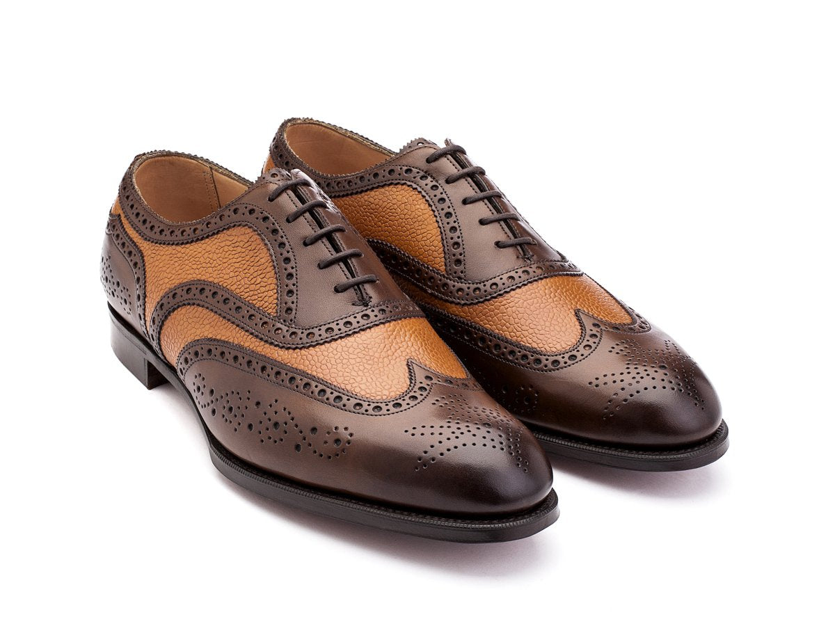 Front angle view of F width Edward Green Falkirk spectator wingtip full brogue oxford shoes in dark oak antique and almond country calf