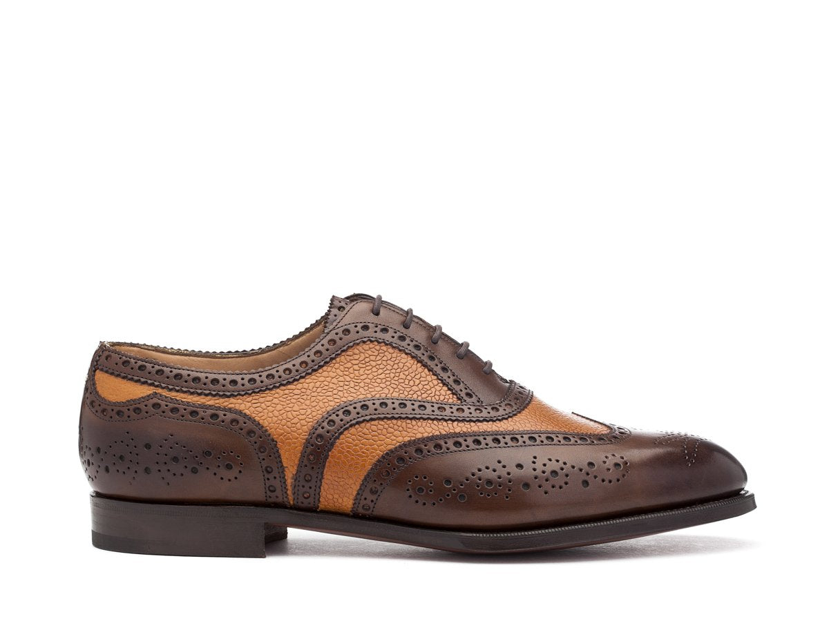Side view of F width Edward Green Falkirk spectator wingtip full brogue oxford shoes in dark oak antique and almond country calf
