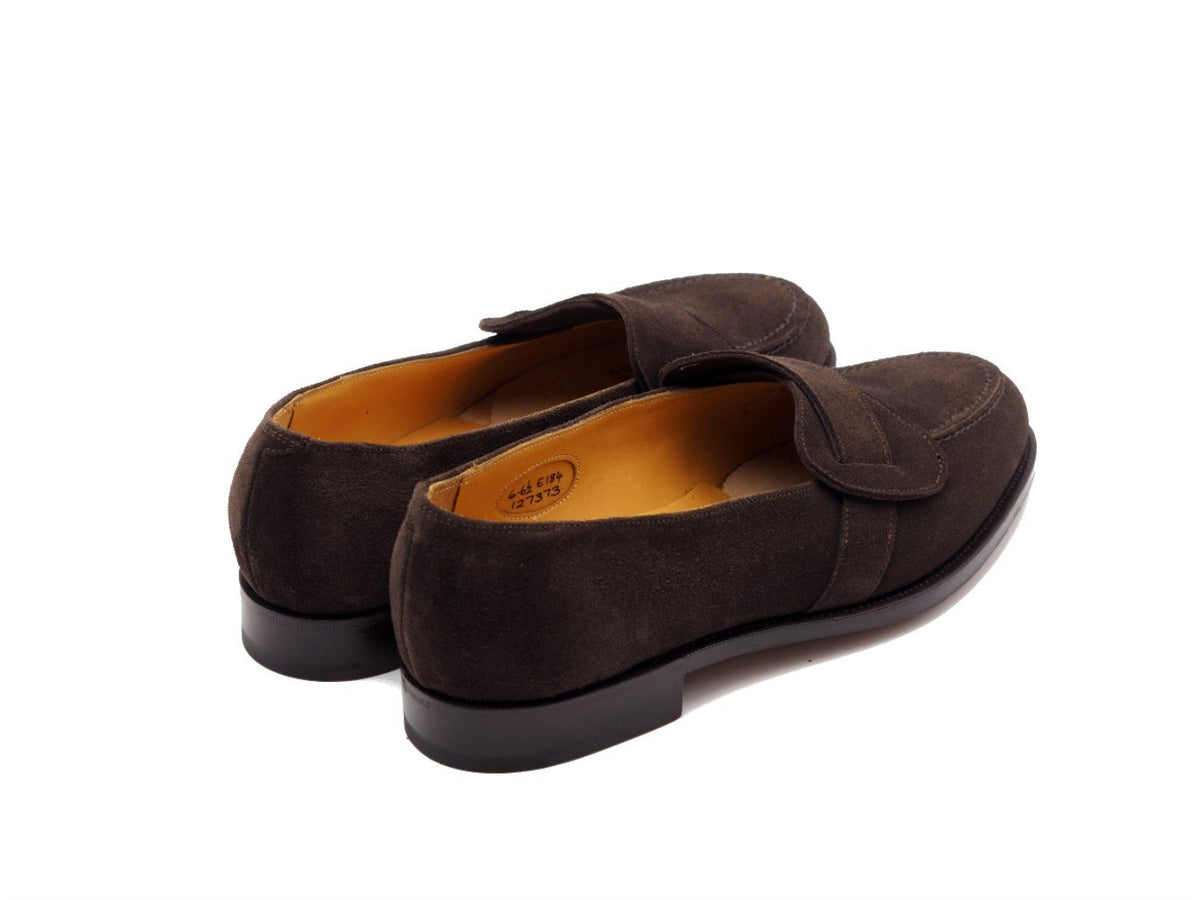 Back angle view of Edward Green Lulworth butterfly strap loafers in espresso suede