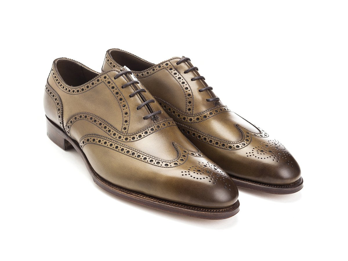Front angle view of Edward Green Malvern wingtip full brogue oxford shoes in chameleon antique calf