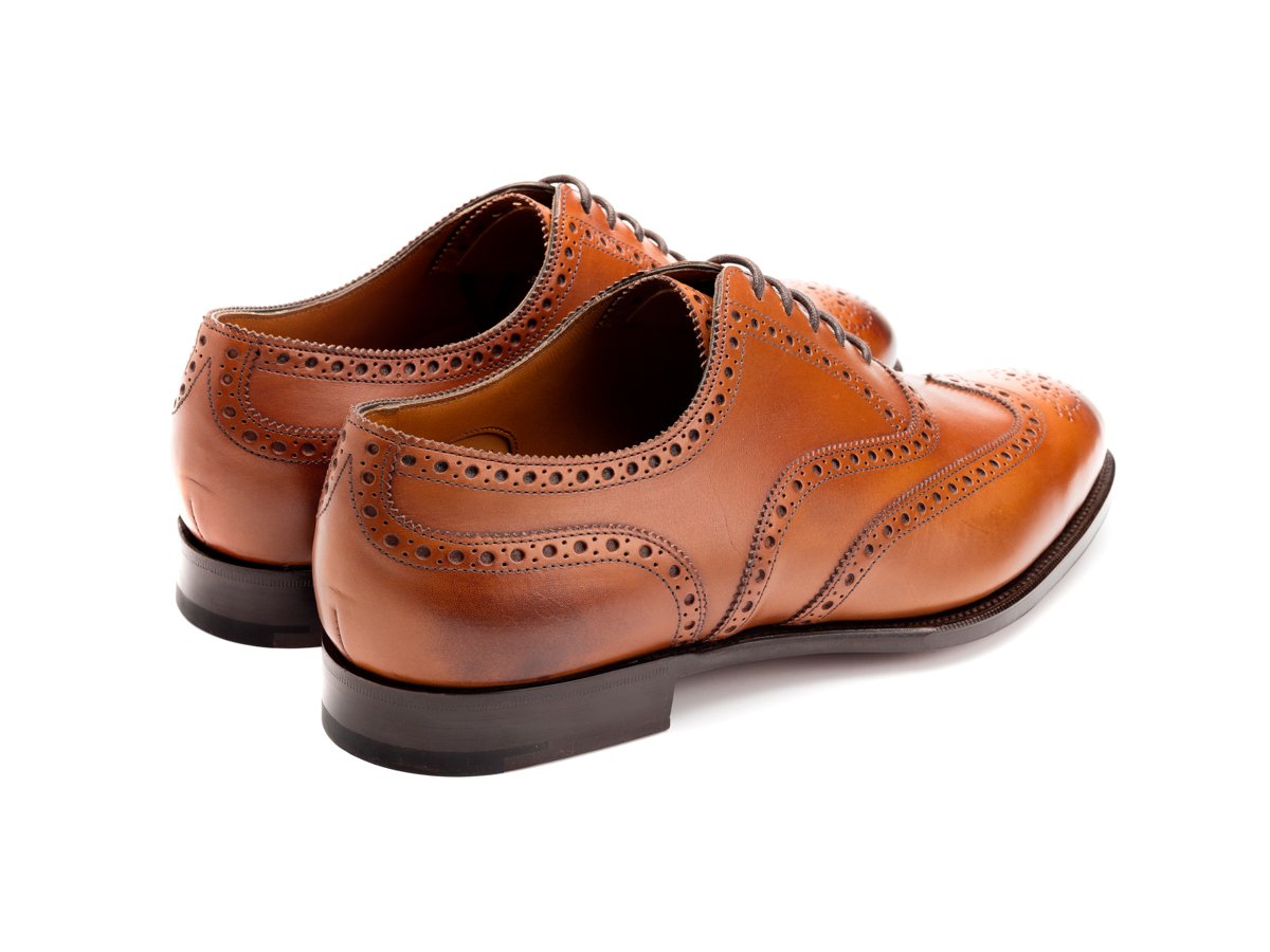 Back angle view of Edward Green Malvern wingtip full brogue oxford shoes in chestnut antique calf
