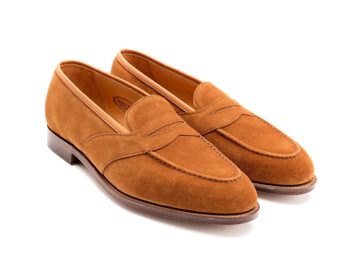 Front angle view of Edward Green Montpellier full strap penny loafer in tobacco suede