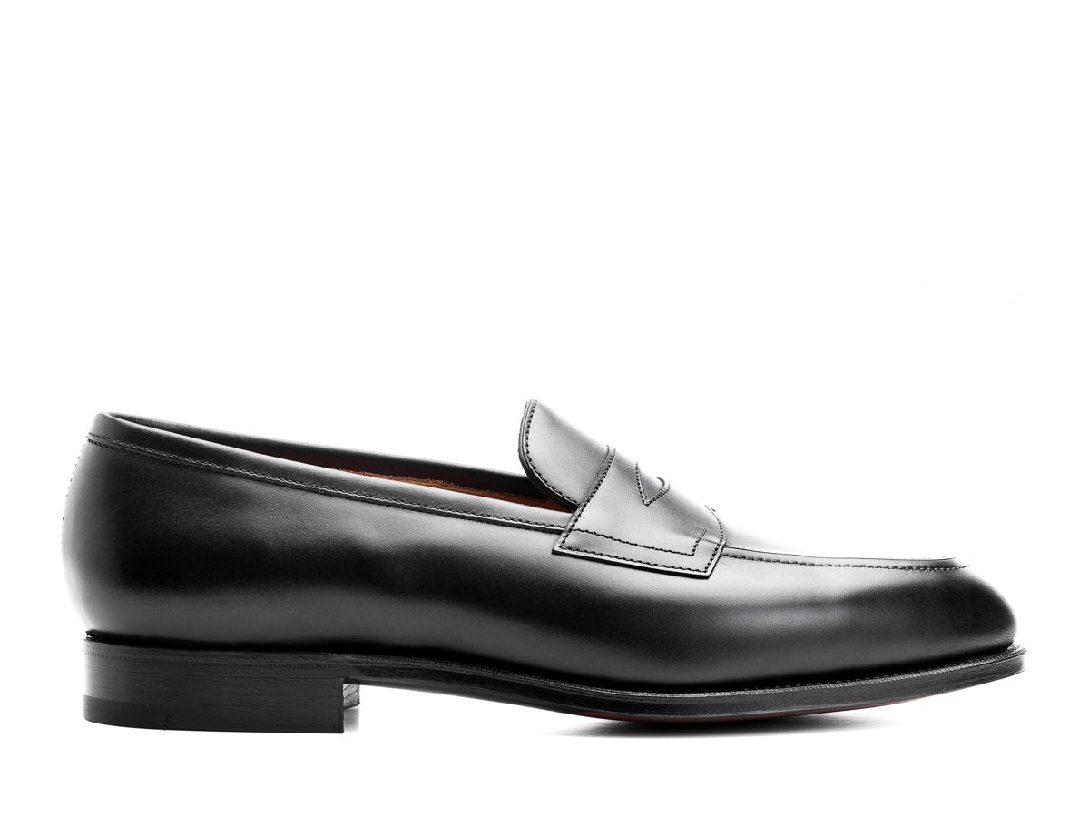 Side view of Edward Green Piccadilly penny loafers in black calf