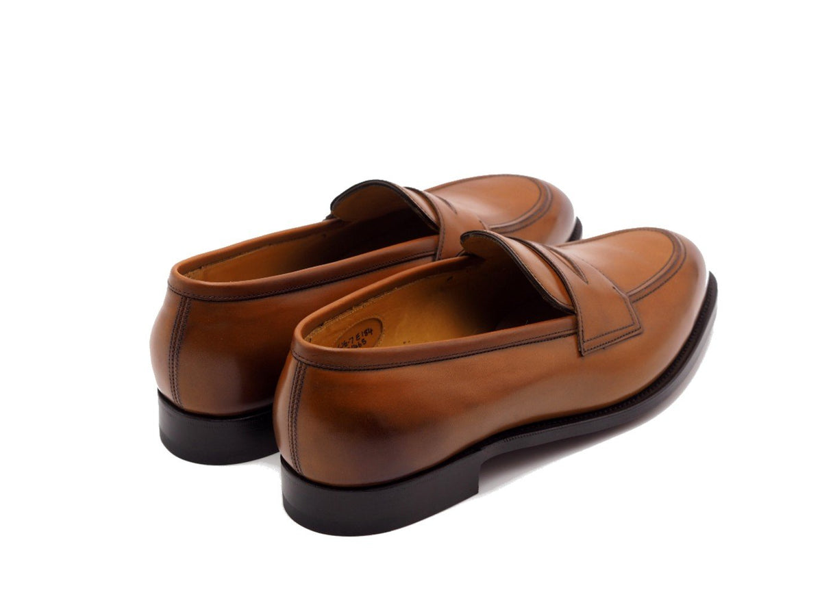 Back angle view of Edward Green Piccadilly penny loafers in chestnut antique calf
