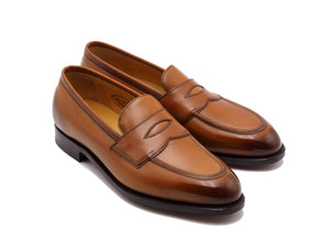 Front angle view of Edward Green Piccadilly penny loafers in chestnut antique calf