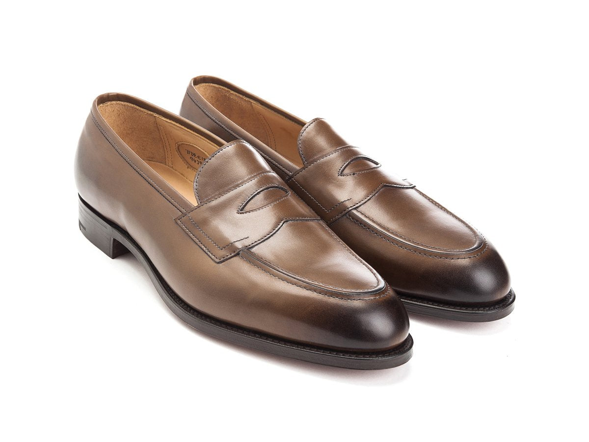 Front angle view of Edward Green Piccadilly penny loafers in dark oak antique calf