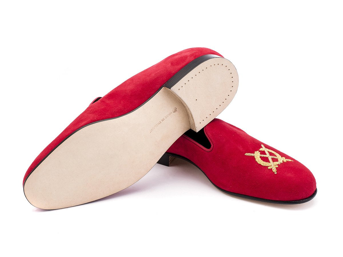 Leather sole of F width Edward Green Royal Albert slippers in scarlet suede with hand embroidered gold wreath and swords crest on toe