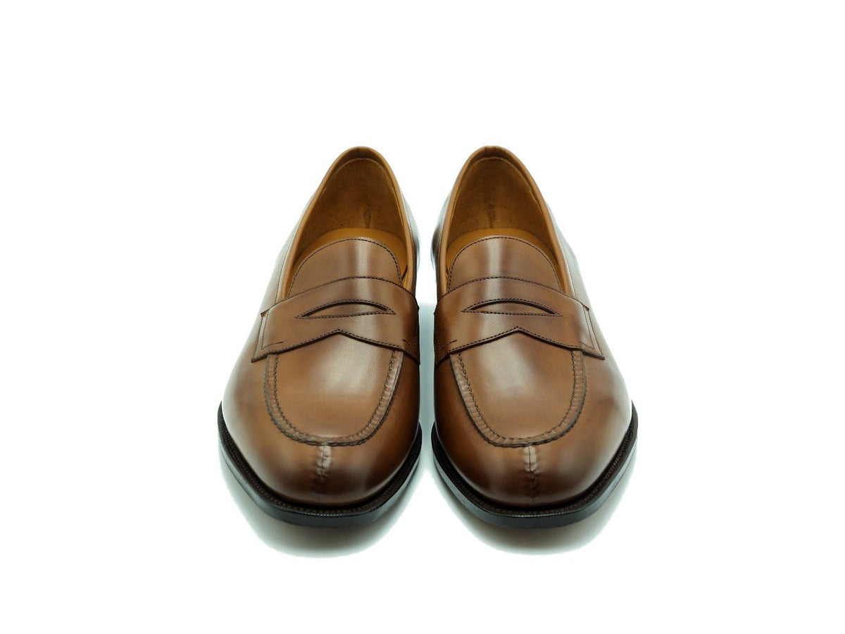 Front view of Edward Green Sloane split toe penny loafers in burnt pine antique calf