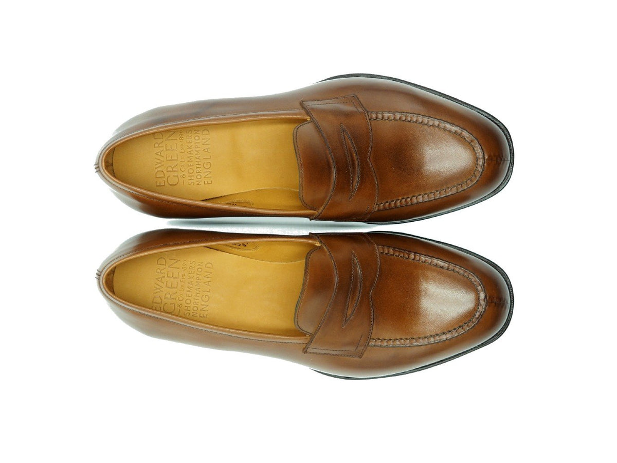 Top view of Edward Green Sloane split toe penny loafers in burnt pine antique calf