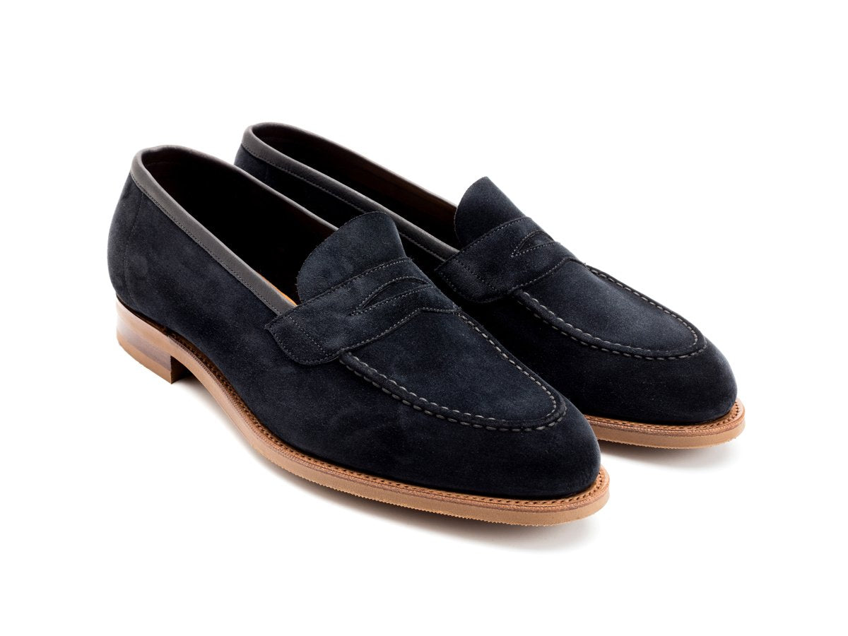Front angle view of Edward Green Ventnor penny loafers in navy suede